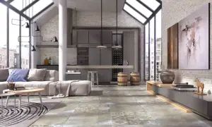 Nowoczesne wnętrze z betonową podłogą, która wygląda jak terakota. Duże okna, kuchnia i salon tworzą loftowy klimat.