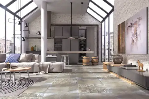 Nowoczesne wnętrze z betonową podłogą, która wygląda jak terakota. Duże okna, kuchnia i salon tworzą loftowy klimat.