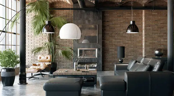Nowoczesny salon w stylu industrialnym z ceglaną ścianą, czarną skórzaną kanapą, fotelem i drewnianym stolikiem kawowym.